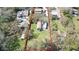 Aerial view showcasing the property's boundaries, large lot, and surrounding neighborhood at 1975 Levine Ln, Clearwater, FL 33760
