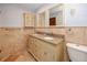 Bathroom features a vanity with double sinks and granite countertops at 1975 Levine Ln, Clearwater, FL 33760
