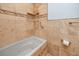 Lovely bathroom with a tiled shower/tub combination featuring a mosaic tile accent at 1975 Levine Ln, Clearwater, FL 33760