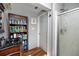 Bathroom featuring a corner shower, vanity, and ample storage shelves for a functional design at 1975 Levine Ln, Clearwater, FL 33760