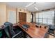 Garage featuring a work desk, wood look floors, and natural light, creating a versatile and functional space at 1975 Levine Ln, Clearwater, FL 33760