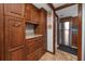 View of the kitchen with lots of cabinet space and stainless steel refrigerator at 1975 Levine Ln, Clearwater, FL 33760