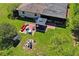 Aerial view of home showcasing outdoor living spaces including a patio, gazebo, and green yard at 2102 W Knights Griffin Rd, Plant City, FL 33565