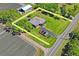 Aerial shot of the property, featuring a spacious lot, well-maintained home, and a convenient driveway at 2102 W Knights Griffin Rd, Plant City, FL 33565