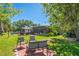 A backyard featuring a gazebo, patio, outdoor seating and screened in porch at 2102 W Knights Griffin Rd, Plant City, FL 33565