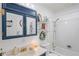 Well-maintained bathroom with a shower-tub combo, stylish vanity, and plenty of storage space at 2102 W Knights Griffin Rd, Plant City, FL 33565