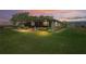 A beautiful home on a sprawling lot, lit by the evening sun at 2102 W Knights Griffin Rd, Plant City, FL 33565