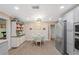 Spacious eat in kitchen with stainless steel appliances, a dining area and lots of cabinetry at 2102 W Knights Griffin Rd, Plant City, FL 33565