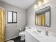Bathroom featuring a vanity with sink, square mirror, and tiled flooring at 2745 Horseshoe Dr, Plant City, FL 33566