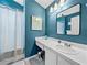 Stylish bathroom features vanity, a large mirror, and a shower with curtain at 2745 Horseshoe Dr, Plant City, FL 33566