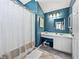 Stylish bathroom features vanity, a large mirror, and a shower with curtain at 2745 Horseshoe Dr, Plant City, FL 33566