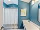 Stylish bathroom features vanity, a large mirror, and a shower with curtain at 2745 Horseshoe Dr, Plant City, FL 33566