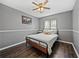 Bedroom featuring a ceiling fan, a bed with a patterned coverlet, and modern decor at 2745 Horseshoe Dr, Plant City, FL 33566