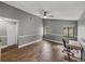Bonus room is set up as an office with wood floors and a ceiling fan at 2745 Horseshoe Dr, Plant City, FL 33566