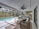 Covered and screened patio with plush seating, and a view of the pool at 2745 Horseshoe Dr, Plant City, FL 33566