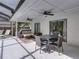 Covered patio with dining table and seating near a sliding glass door at 2745 Horseshoe Dr, Plant City, FL 33566