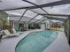 Enclosed pool area with ample seating and a screen enclosure that overlooks the backyard at 2745 Horseshoe Dr, Plant City, FL 33566