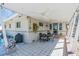 Spacious covered patio with ceiling fans and decorative pavers, ideal for outdoor dining and relaxation at 276 Snell Isle Ne Blvd, St Petersburg, FL 33704