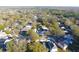 Neighborhood aerial view showing residential homes surrounded by mature trees at 3012 E 149Th Ave, Lutz, FL 33559