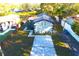 Aerial view of the property showcasing the house, new driveway, and spacious backyard at 3012 E 149Th Ave, Lutz, FL 33559