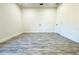 An empty bedroom features laminate flooring, closet and a window that lets in natural light at 3012 E 149Th Ave, Lutz, FL 33559