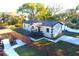 Charming home featuring a landscaped yard, paved walkway and driveway, and a classic, neutral color scheme at 3012 E 149Th Ave, Lutz, FL 33559