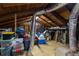 Unfinished attic space with wooden beams, ample storage, and a gable window at 3235 8Th N Ave, St Petersburg, FL 33713