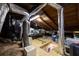 Spacious attic featuring wooden beams, ductwork, and ample storage, offering potential for renovation at 3235 8Th N Ave, St Petersburg, FL 33713