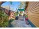 Inviting backyard area, featuring a patio with a sunshade, greenery, and rustic accents at 3235 8Th N Ave, St Petersburg, FL 33713