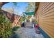 Cozy backyard patio with shade sails, a lush garden, and comfortable seating at 3235 8Th N Ave, St Petersburg, FL 33713