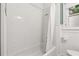 Clean bathroom with a white tiled shower and tub, complemented by beadboard paneling at 3235 8Th N Ave, St Petersburg, FL 33713