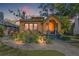 Charming yellow home with a brick walkway, lush landscaping, and inviting front porch at 3235 8Th N Ave, St Petersburg, FL 33713