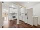 Well-lit kitchen with white cabinets, modern appliances, and dark hardwood floors at 3235 8Th N Ave, St Petersburg, FL 33713