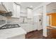 Bright white kitchen featuring stainless steel appliances and modern countertops at 3235 8Th N Ave, St Petersburg, FL 33713