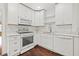 Modern kitchen with white cabinets, stainless steel appliances, and subway tile backsplash at 3235 8Th N Ave, St Petersburg, FL 33713