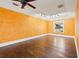 Spacious living room featuring hardwood floors, textured walls, and a tray ceiling with lighting at 3235 8Th N Ave, St Petersburg, FL 33713