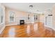 Bright living room with beautiful hardwood floors and a classic brick fireplace at 3235 8Th N Ave, St Petersburg, FL 33713