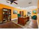 Inviting office space features hardwood floors, complementary decor, large desk, and bright natural light at 3235 8Th N Ave, St Petersburg, FL 33713
