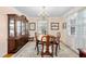 Traditional dining room showcases classic furnishings, elegant chandelier, and natural light at 3810 W Granada St, Tampa, FL 33629