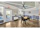 Well-lit clubhouse featuring tile floors, ample seating, and access to outdoor area at 4221 W Spruce St # 1123, Tampa, FL 33607