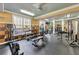 Community gym featuring stationary bikes, treadmills, weights, and multiple ceiling fans at 4221 W Spruce St # 1123, Tampa, FL 33607