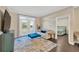 Open living room featuring french doors, modern furniture, and decorative rug at 4221 W Spruce St # 1123, Tampa, FL 33607