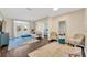 Living room with hardwood floors, stylish furniture, and french doors to the balcony at 4221 W Spruce St # 1123, Tampa, FL 33607