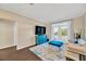 Bright living room with stylish furniture, hardwood floors, and french doors at 4221 W Spruce St # 1123, Tampa, FL 33607