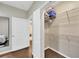 A walk-in closet with wire shelving and a mirror on the door at 4221 W Spruce St # 1123, Tampa, FL 33607