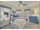 Cozy bedroom with blue and white decor, comfortable bedding, and ample natural light at 439 San Salvador Dr, Dunedin, FL 34698