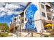 Modern building with a striking blue mural, enhancing the community's vibrant atmosphere at 439 San Salvador Dr, Dunedin, FL 34698