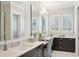 Spacious bathroom with double sinks, marble counters, stylish decor, and lots of natural light at 4857 Tobermory Way, Bradenton, FL 34211