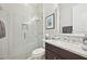 Elegant bathroom features a glass-enclosed shower, marble vanity, and modern fixtures for a spa-like experience at 4857 Tobermory Way, Bradenton, FL 34211