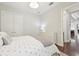 Bright bedroom with hardwood floors, a closet, and a view into the living space at 4857 Tobermory Way, Bradenton, FL 34211